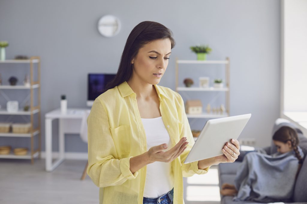 Online medical consultation. Parents and a child consult a doctor using a tablet at home. Family doctor call online.Parents and a child consult a doctor using a tablet at home. Online medical consultation.